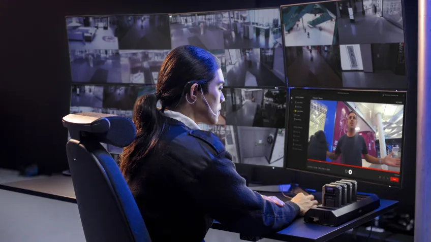Women looking at body worn camera footage in a RTCC.