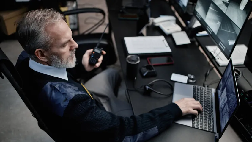 Security personell working in a real-time crime center.