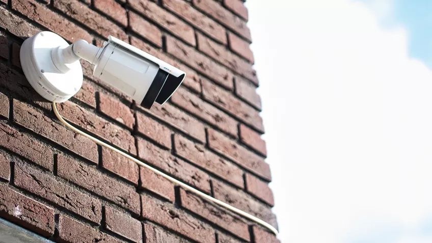 AXIS Q1765-LE Network Camera on a brick wall